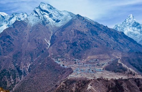 Free A breathtaking aerial view of a village nestled in the Himalayan mountains of Nepal. Stock Photo
