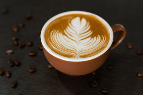 Fresh brew of cafe latte in a brown mug