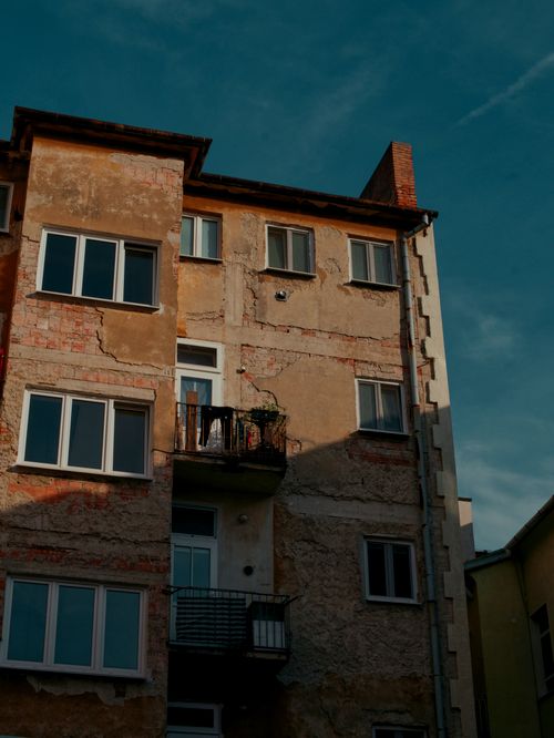 Free Old residential facade with visible wear in Bratislava. Urban character and history. Stock Photo