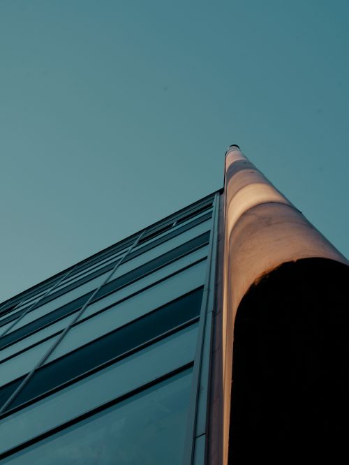 Free Tall skyscraper in Bratislava showcasing modern architecture against a sunset sky. Stock Photo