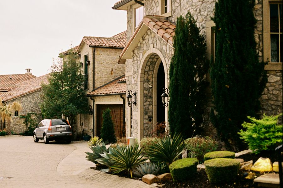 Elegant stone mansion with gated entry in a Stone Oak community