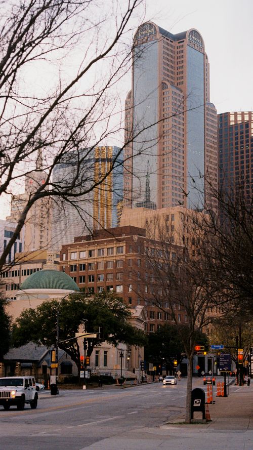 Free A scenic view of Dallas's downtown district showcasing skyscrapers and urban streets. Stock Photo