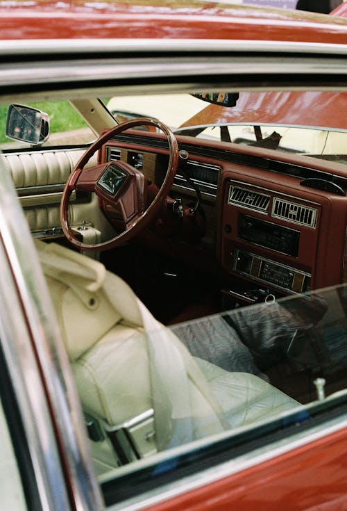 A car interior with a steering wheel and dashboard
