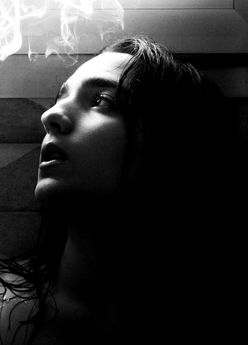 Free A mysterious black and white portrait of a person looking upwards surrounded by smoke. Stock Photo