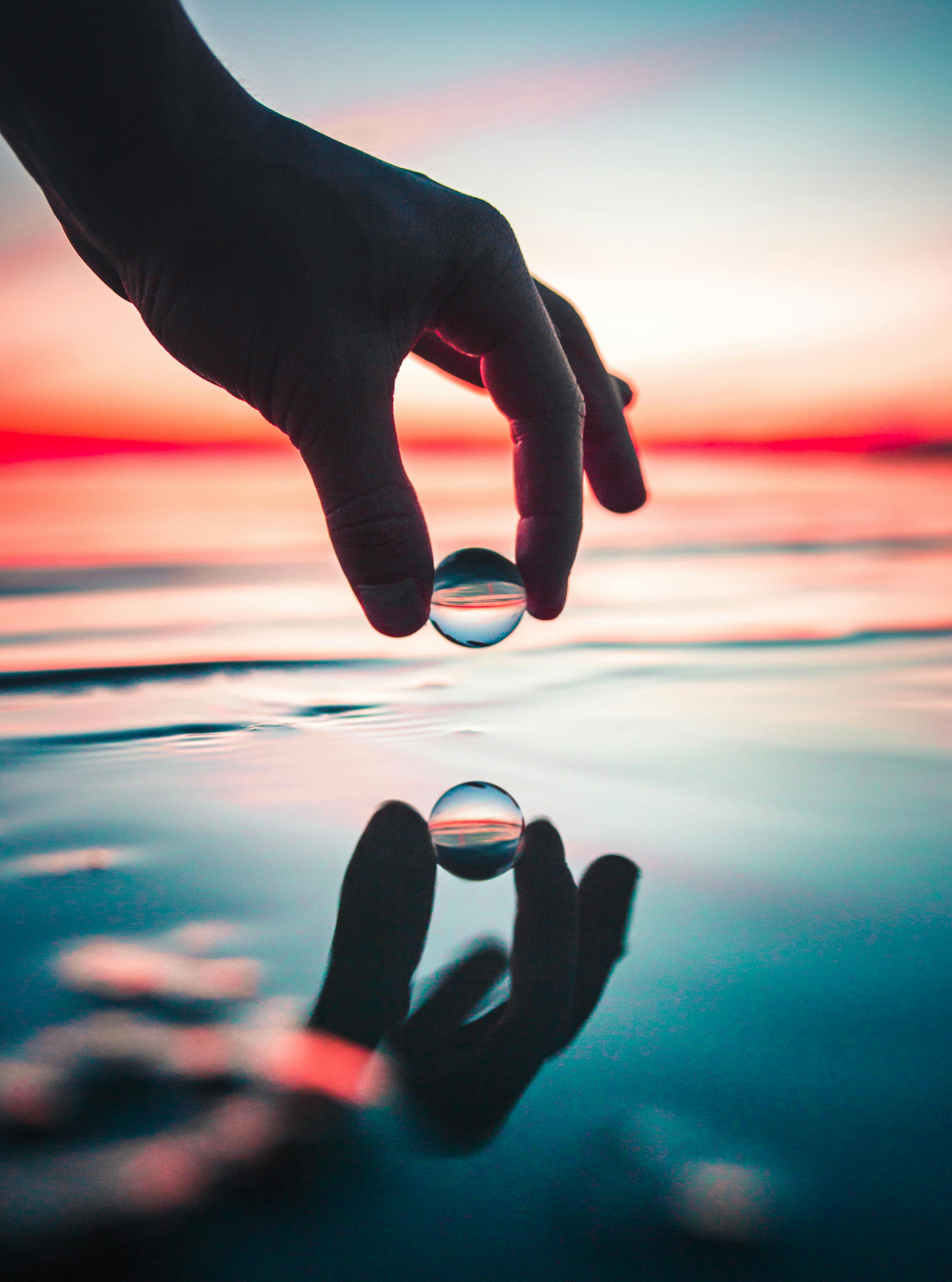 Person Holding Marble Toy · Free Stock Photo