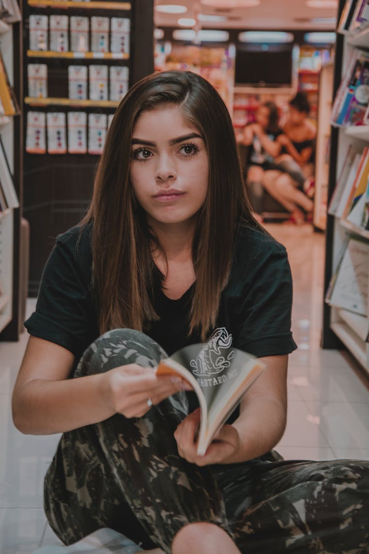 Photo Of Woman Opening A Book