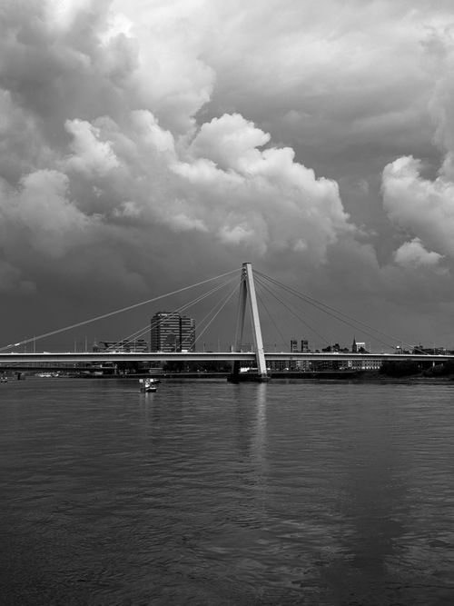 Free Striking black and white photo of a modern bridge with dramatic clouds. Stock Photo