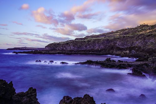 A beautiful sunset over the ocean and rocks