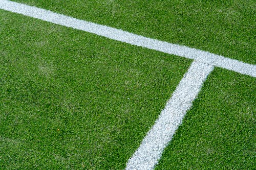 A close up of a soccer field with white lines