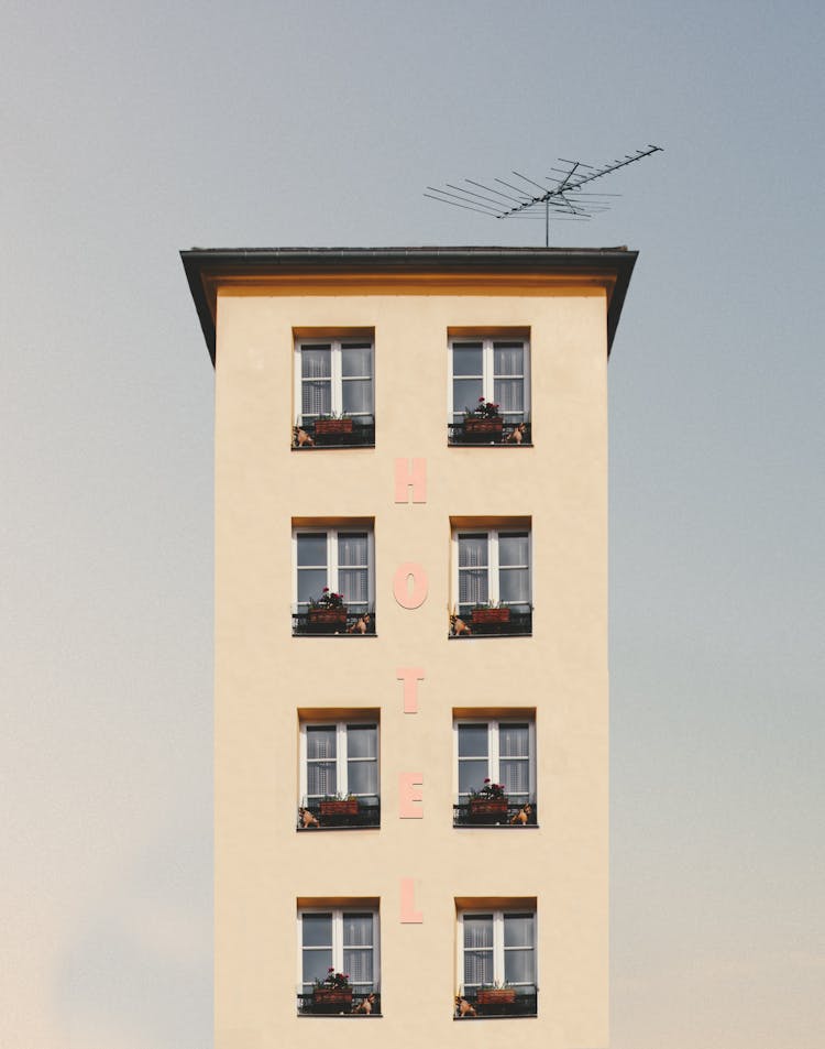 Low-angle Photography Of Beige Concrete Building