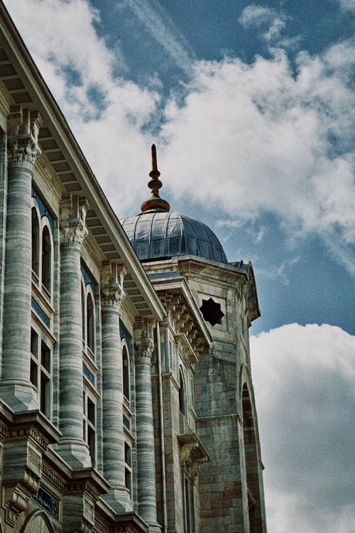 Free Elegant architectural structure with a domed roof against a bright sky. Stock Photo