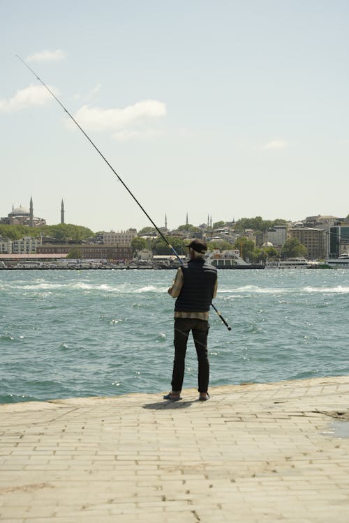 A man is fishing on the water