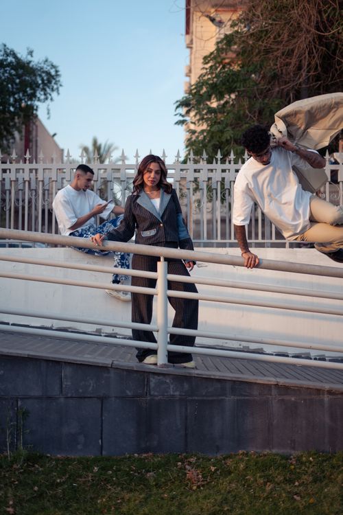 Free Young adults expressing fashion and style in a vibrant urban scene in Baghdad. Stock Photo