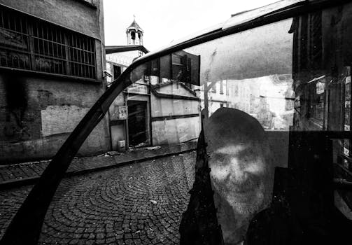 Black and white portrait reflecting urban life in Istanbul's streets, showcasing an elderly man's expression.