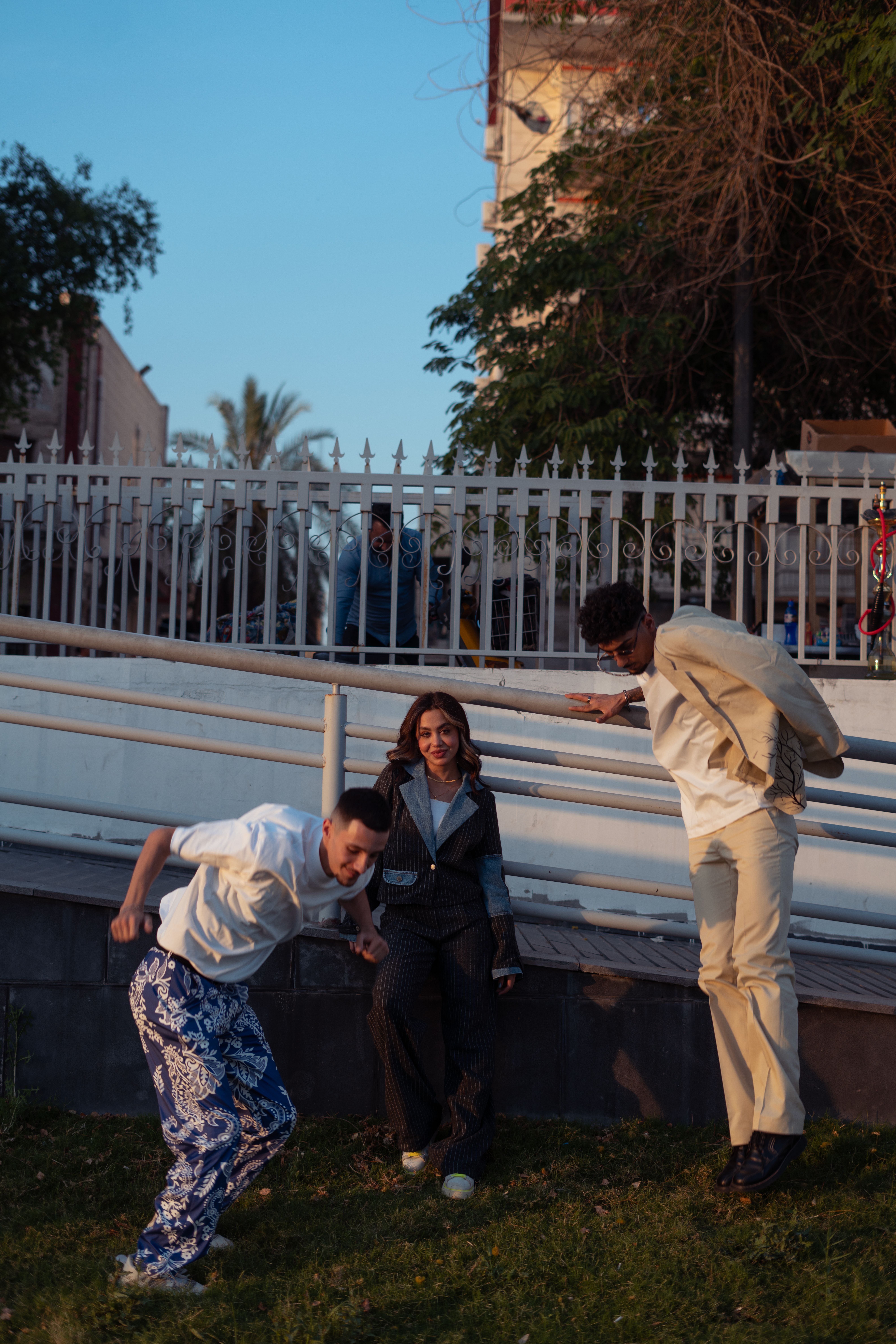 Three People Next to a Railing · Free Stock Photo