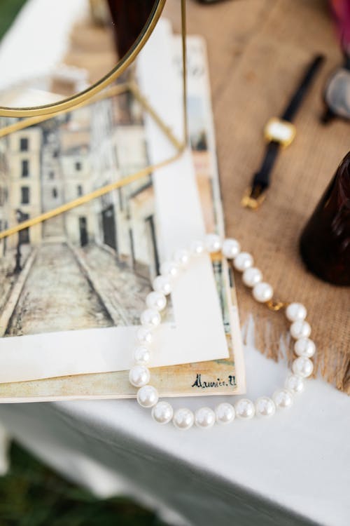 A necklace and bracelet on a table