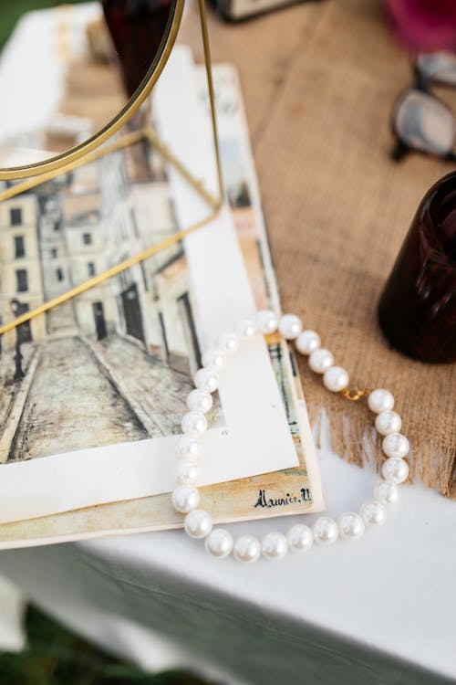 A necklace and a book on a table