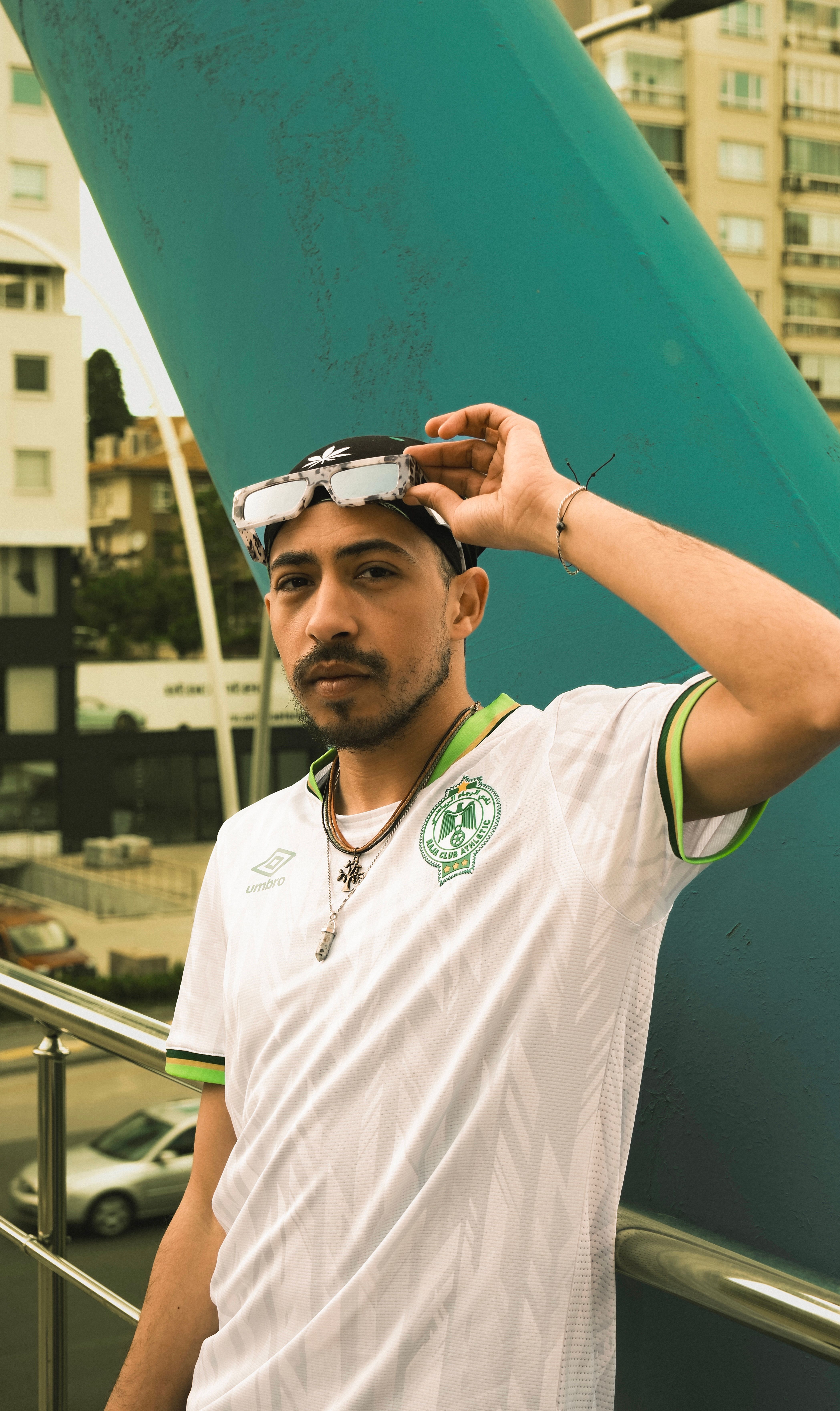 Portrait of a man in trendy fashion, posing in urban Ankara, Türkiye.