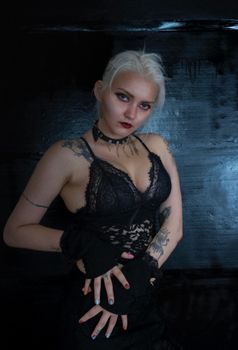Edgy portrait of a woman with tattoos and gothic style in Ankara.