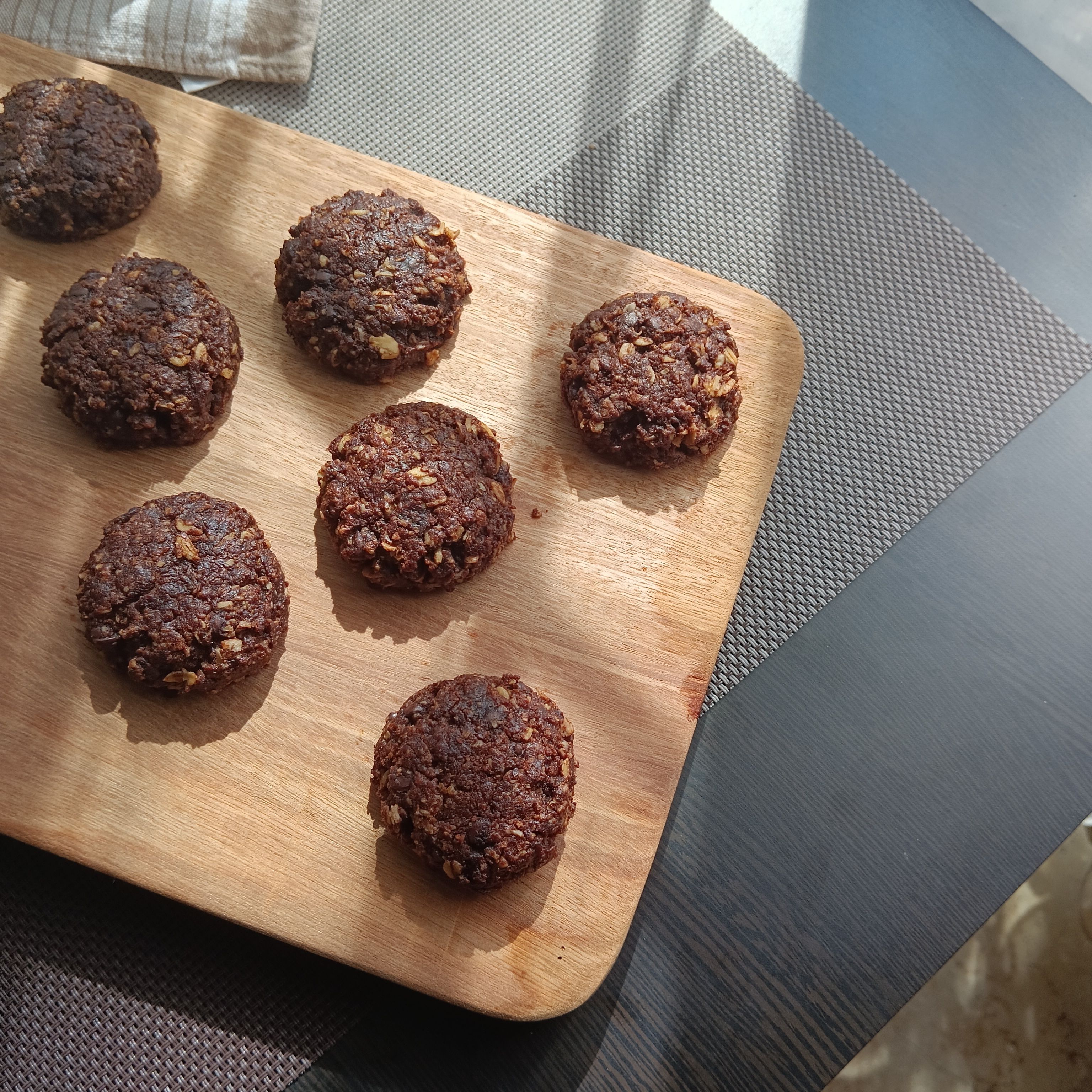 Homemade cocoa oat cookies on a board — Arts Dianti on Pexels