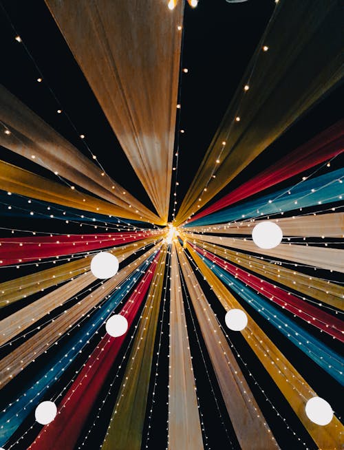 A colorful wedding canopy with lights