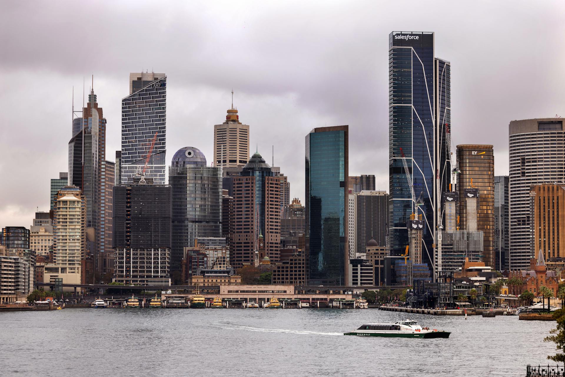 Stunning cityscape of Sydney featuring iconic skyscrapers including Salesforce Tower by the waterfront.