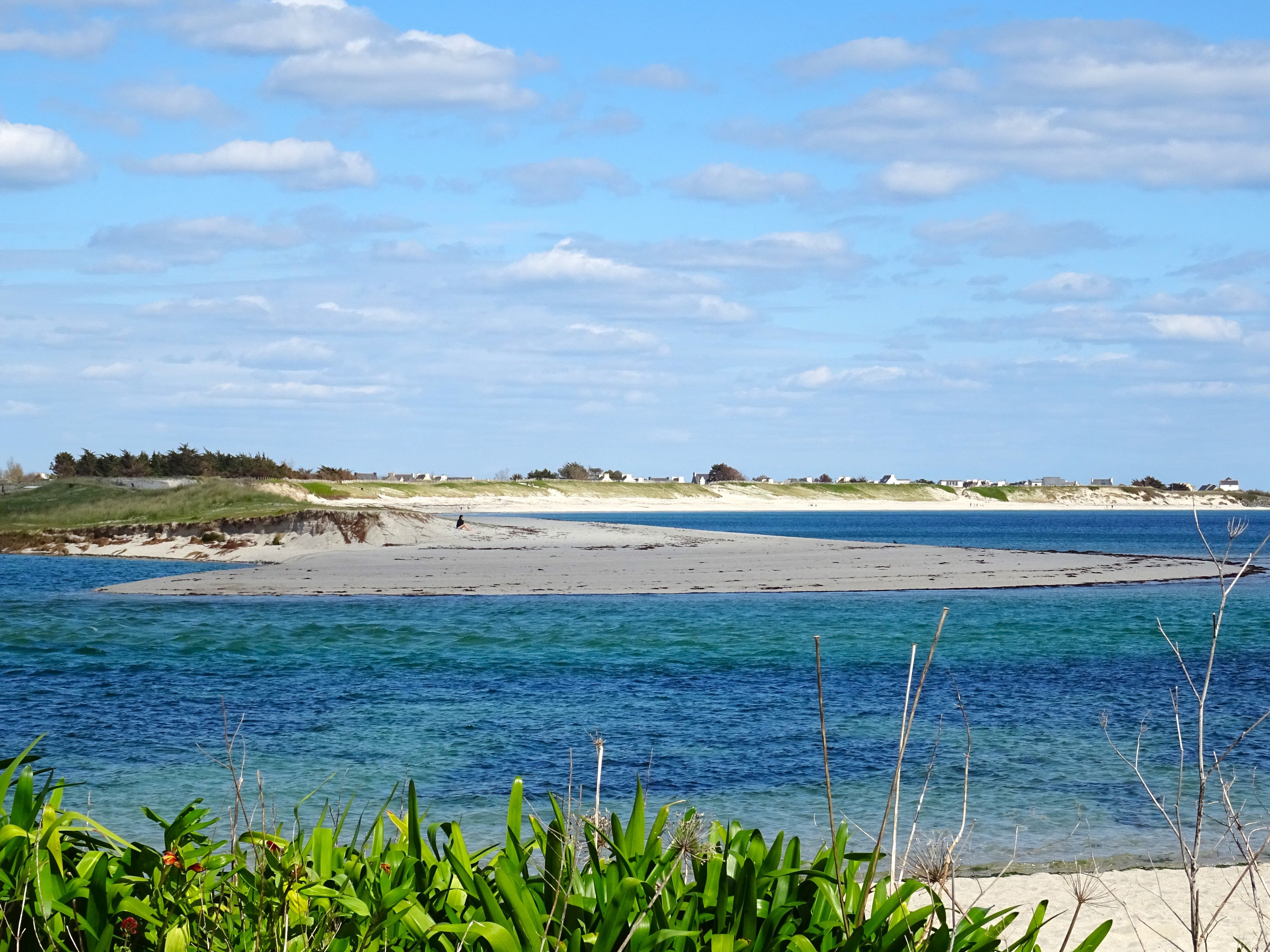 A Sandy Beach with a Small Island in the Middle · Free Stock Photo