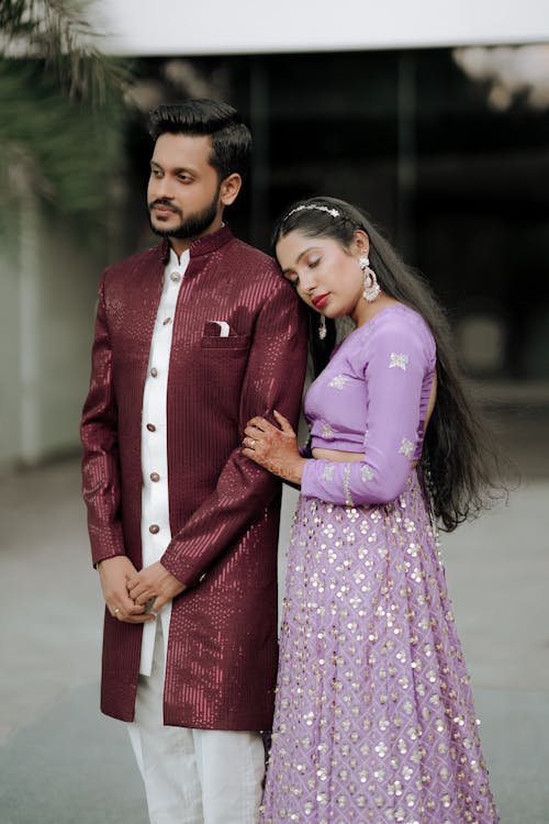 A man and woman in traditional indian attire