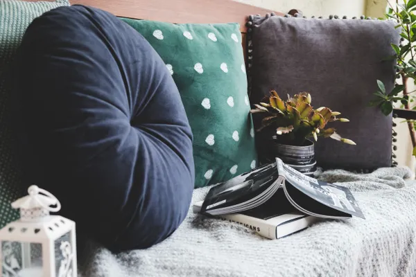 Cushions in green and grey on a day bed