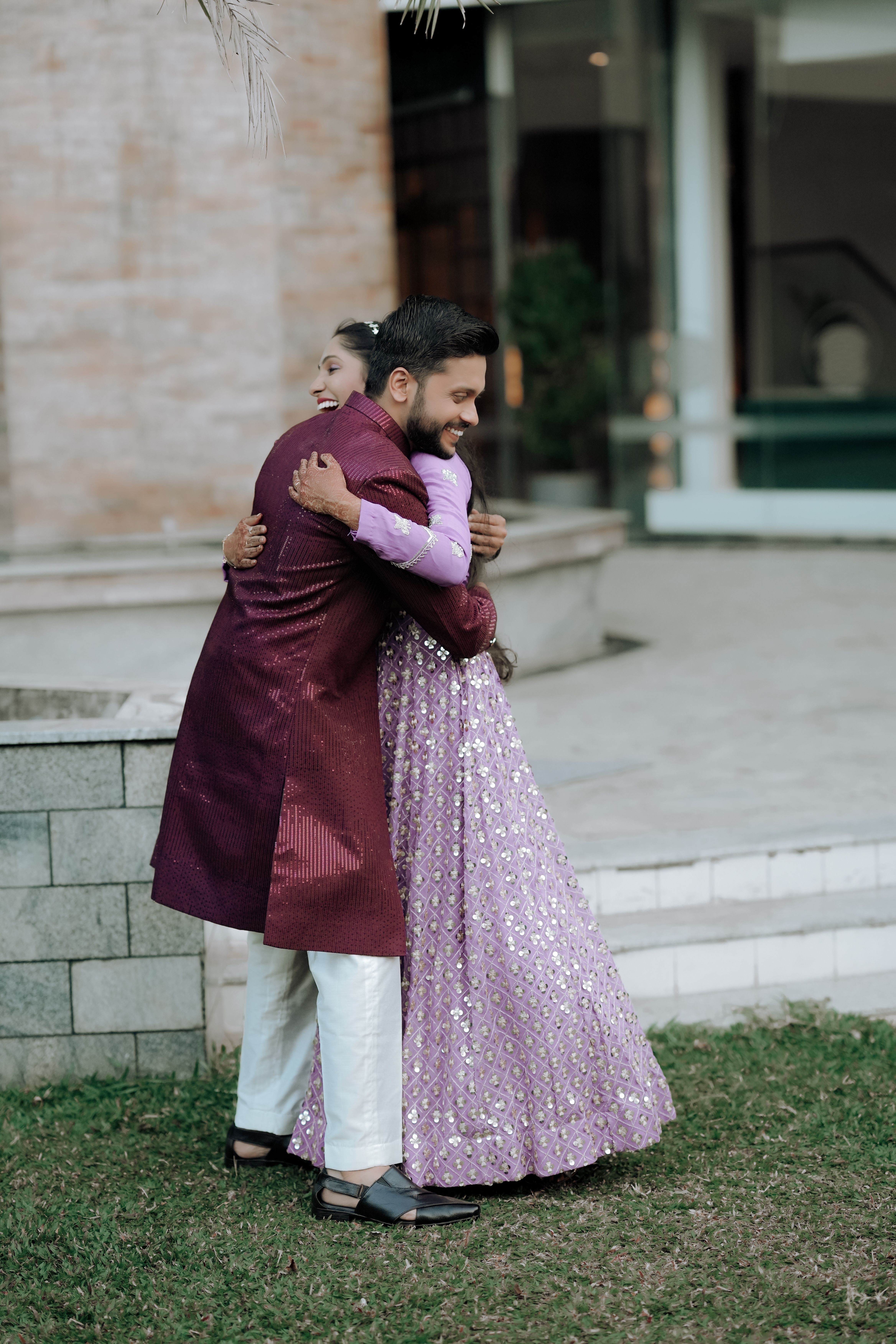 Smiling Couple Hugging in Traditional Clothing · Free Stock Photo