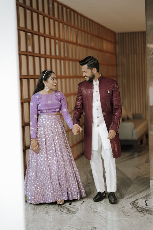 A man and woman in traditional indian attire