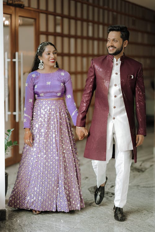 A man and woman in traditional indian attire