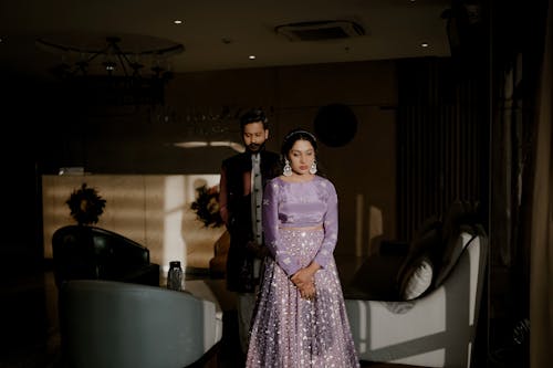 A bride and groom standing in the lobby of their hotel