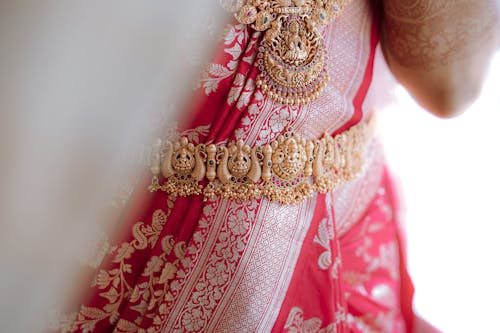 A close up of a woman in a pink sari