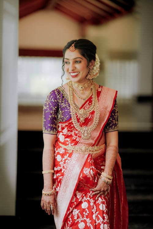 A beautiful indian bride in red and gold sari