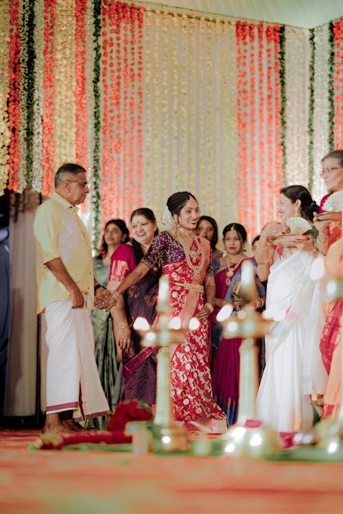 A wedding ceremony in india with people in traditional attire