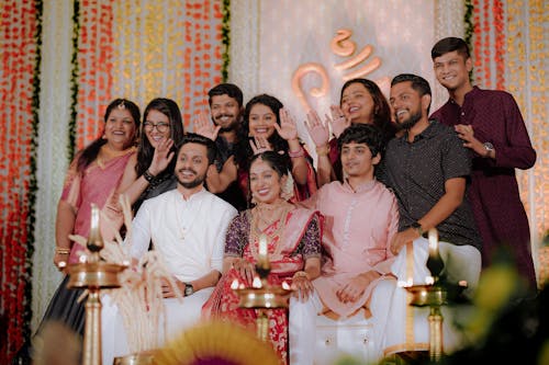 A group of people posing for a photo at a wedding