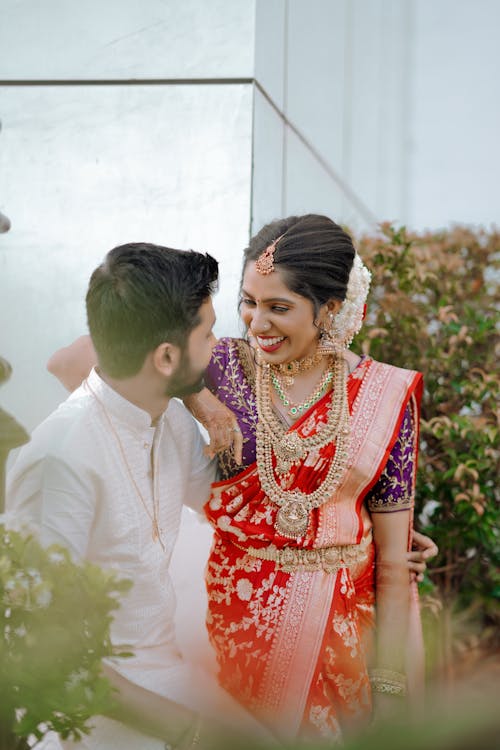 A bride and groom in traditional indian attire