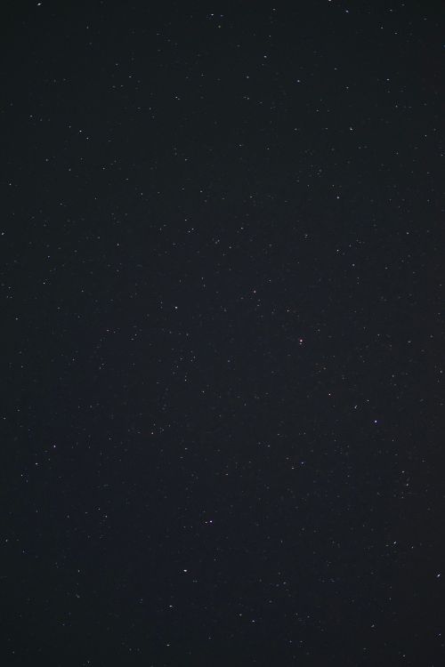 Free A captivating view of the starry night sky filled with shimmering stars and constellations. Stock Photo