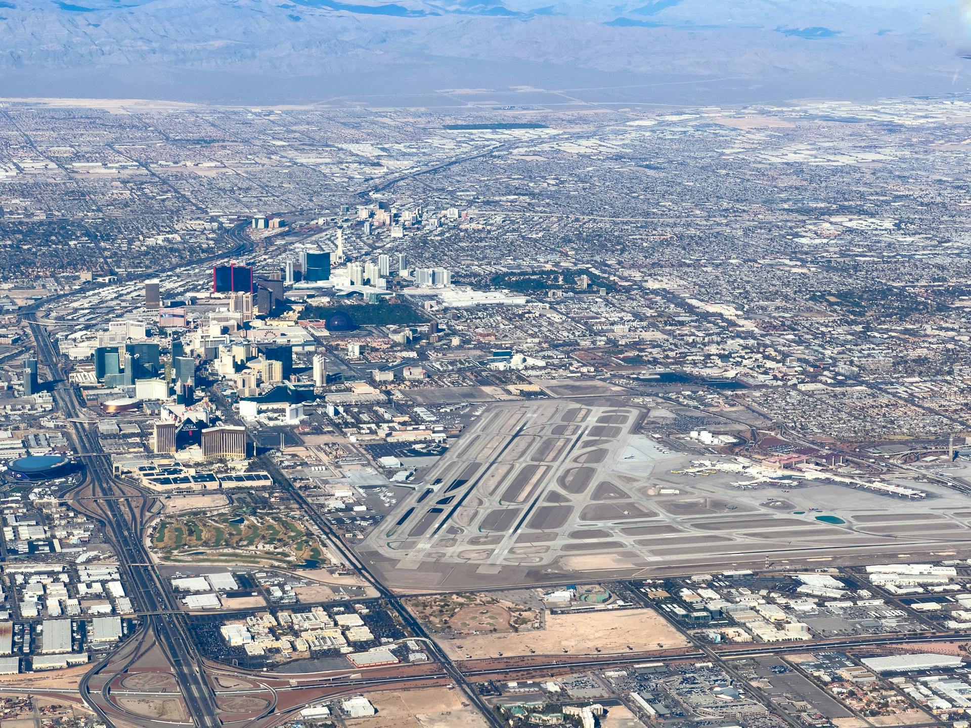 Explore Las Vegas from the sky showcasing the airport and city skyline.