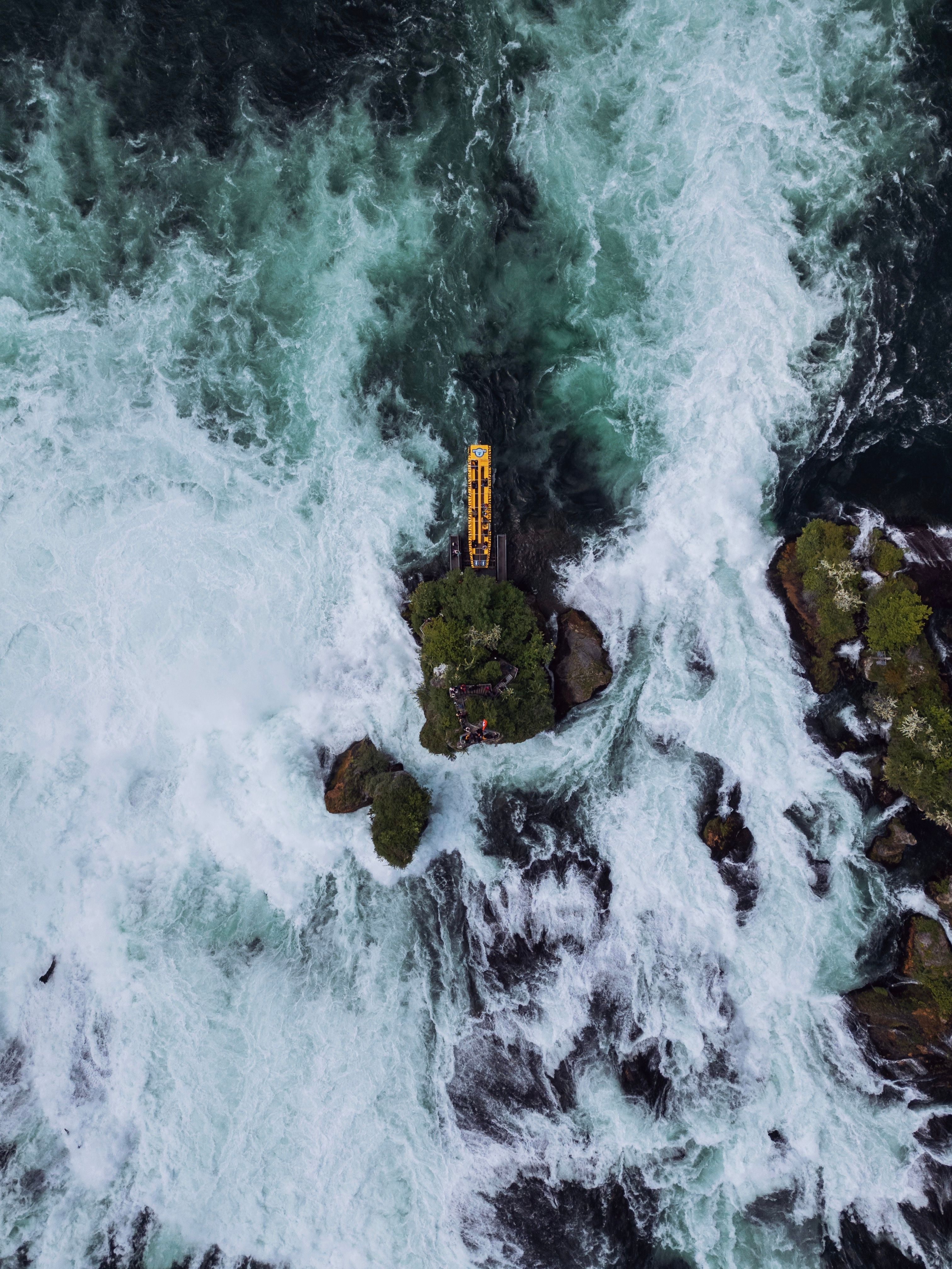 Yellow Raft on Rough Sea by Coast · Free Stock Photo