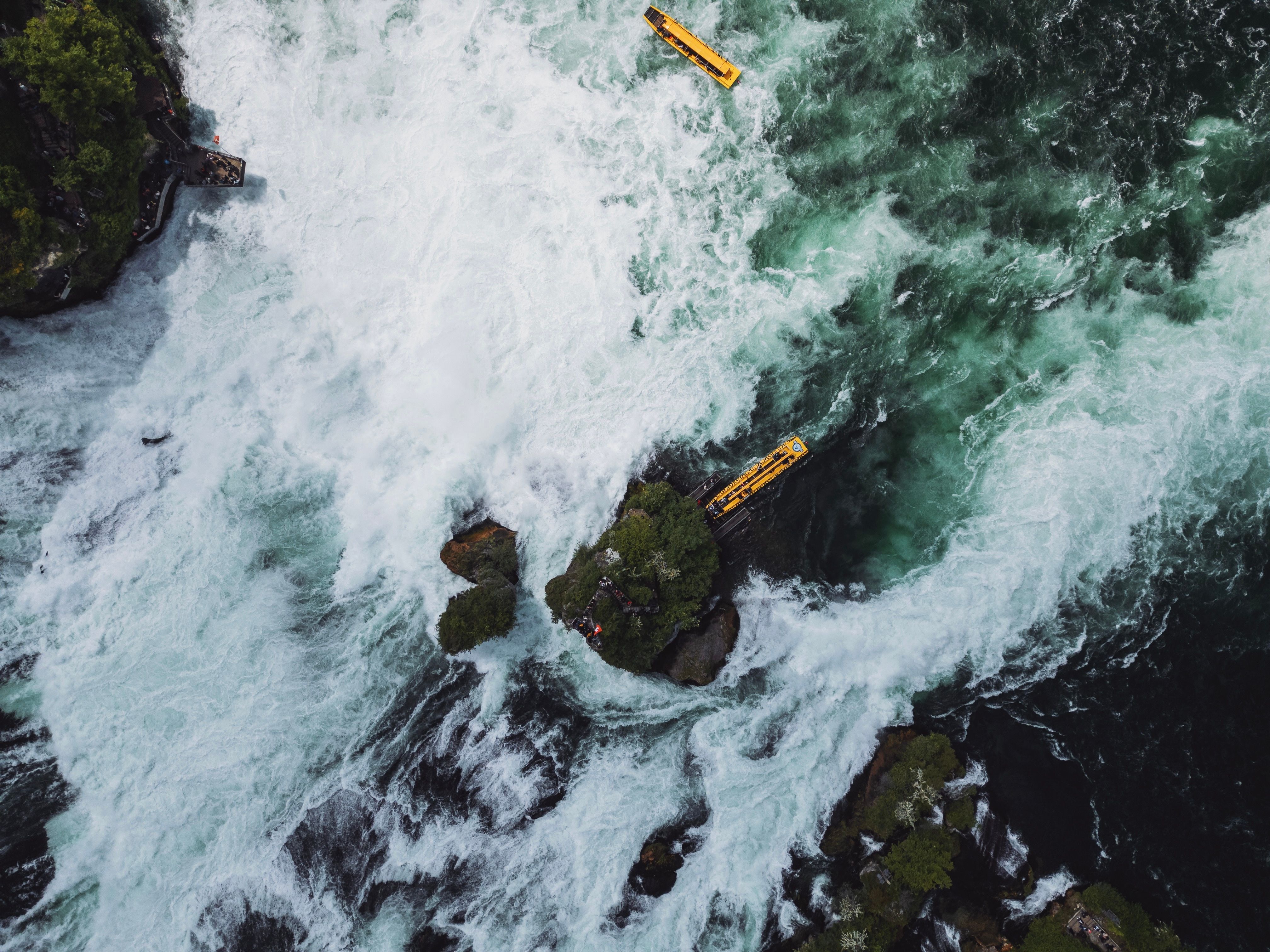 Incredible Scenic Helicopter Ride Above the Falls (Window View) Review: Soaring Over Victoria Falls Review 2026 - Majestic aerial capture of Rhine Falls with yellow boats navigating the rapids.