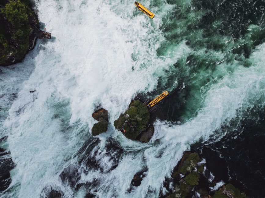 Incredible Scenic Helicopter Ride Above the Falls (Window View) Review: Soaring Over Victoria Falls Review 2026 - Majestic aerial capture of Rhine Falls with yellow boats navigating the rapids.