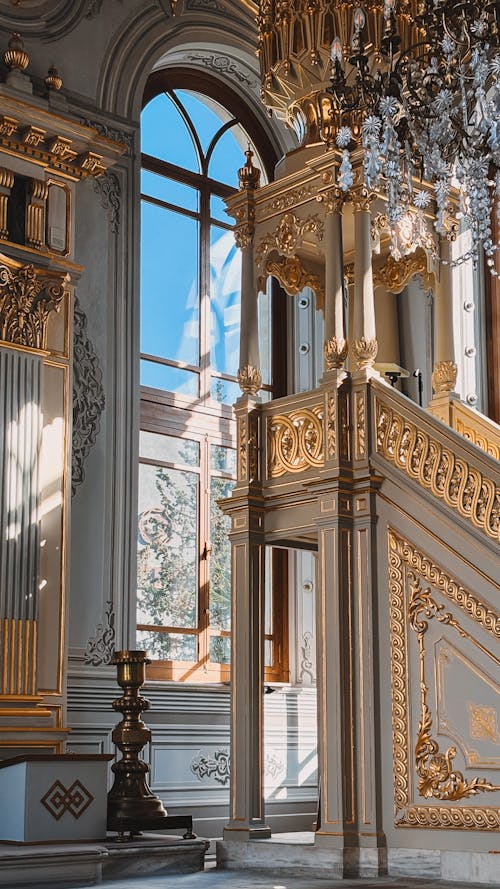 The staircase in the palace is decorated with gold and white