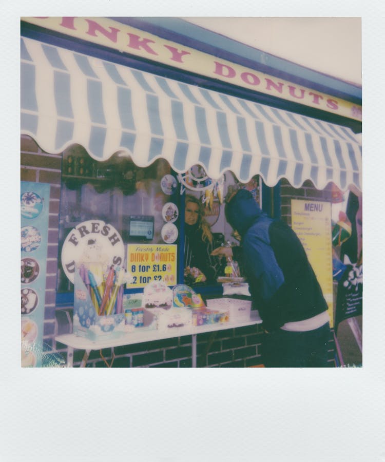 Man Buying From A Shopkeeper