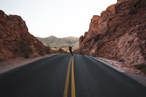 Person Standing on Road