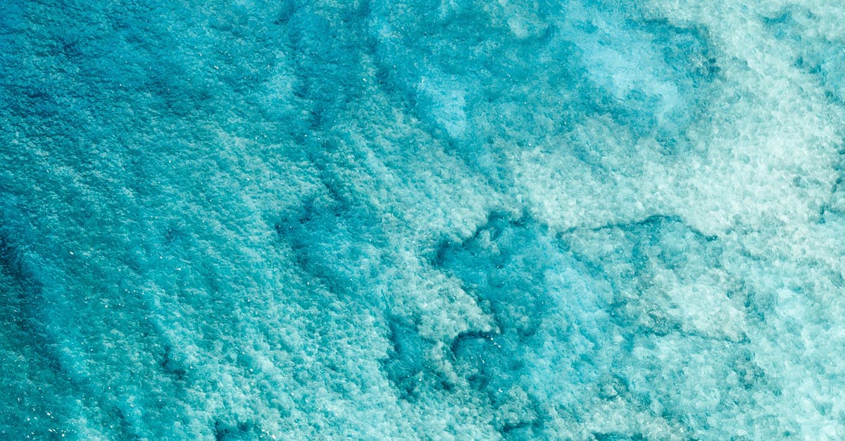 Photo by Jeremy Bishop Stunning aerial view of vibrant turquoise waters capturing natural beauty and tranquility.