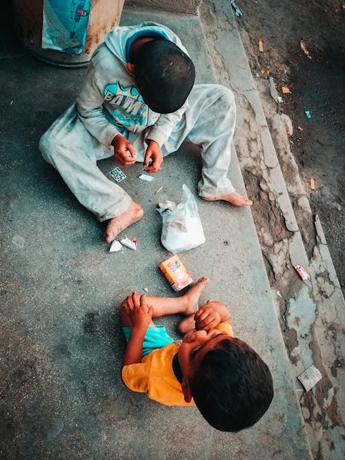 Free kids playing in street Stock Photo