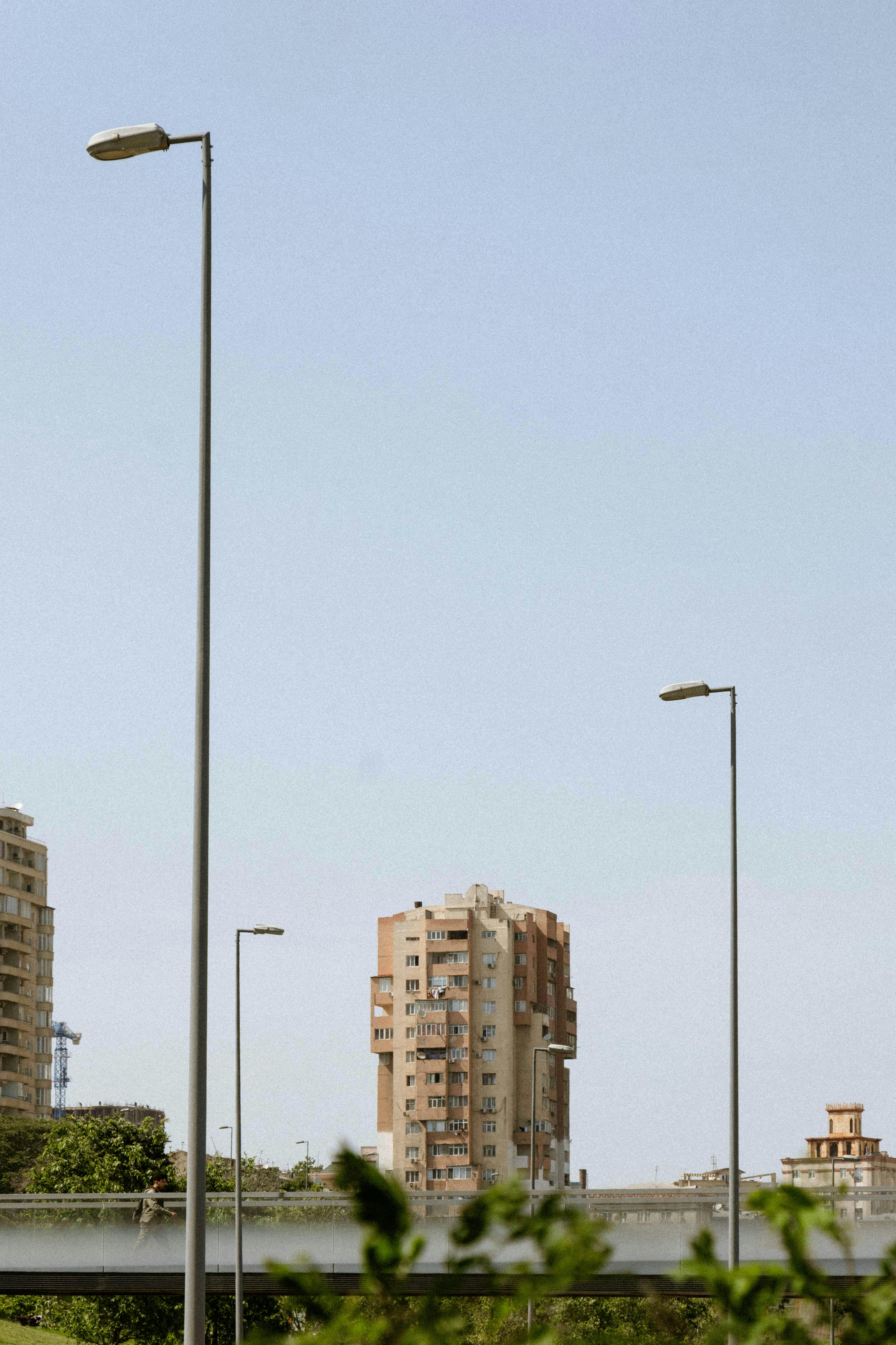 Modern high-rise buildings and streetlights in Baku, Azerbaijan's urban landscape.