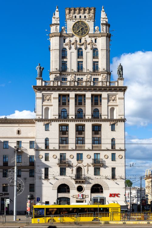 Free A vertical shot of the Gates of Minsk with a bright blue sky and urban scenery. Stock Photo